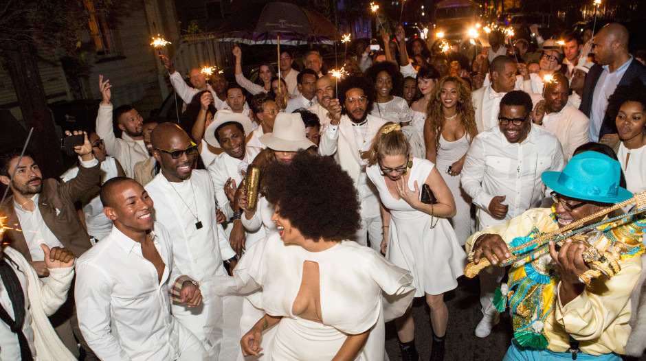 NEW ORLEANS, LA - NOVEMBER 16:  Musician Solange Knowles (C) and her new husband, music video director Alan Ferguson second line in the streets of New Orleans with family and guests after her wedding on November 16, 2014 in New Orleans, Louisiana.  (Photo by Josh Brasted/WireImage)