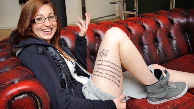 PLEASE NOTE: EMBARGO FOR ONLINE: Cannot be used before 00.01 hours Wednesday 2nd November. Solent: MTV competition finalist Sarah Burgoyne (24), pictured, shows what she is willing to do for music by having the lyrics to a Justin Bieber song tattooed on her thigh. Sarah is 1 of 4 winners who will be at the 2011 MTV EMA in Belfast on the 6th Nov © Solent News & Photo Agency UK +44 (0) 2380 458800