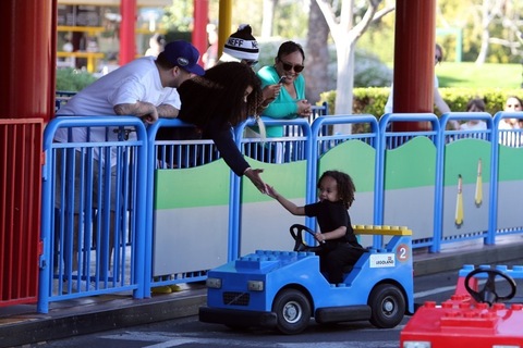 **PREMIUM RATES APPLY**  Rob Kardashian enjoys a day at Legoland with girlfriend Blac Chyna and rides a slide with her son King Cairo in Los Angeles. Rob was holding a water bottle as he walked with his girl and her son through the fun park. Rob was also spotted taking photos of her as the group went through their fun day together. They were also laughing together as they rode on the back of a rollercoaster with other members of her family a day before his birthday.
